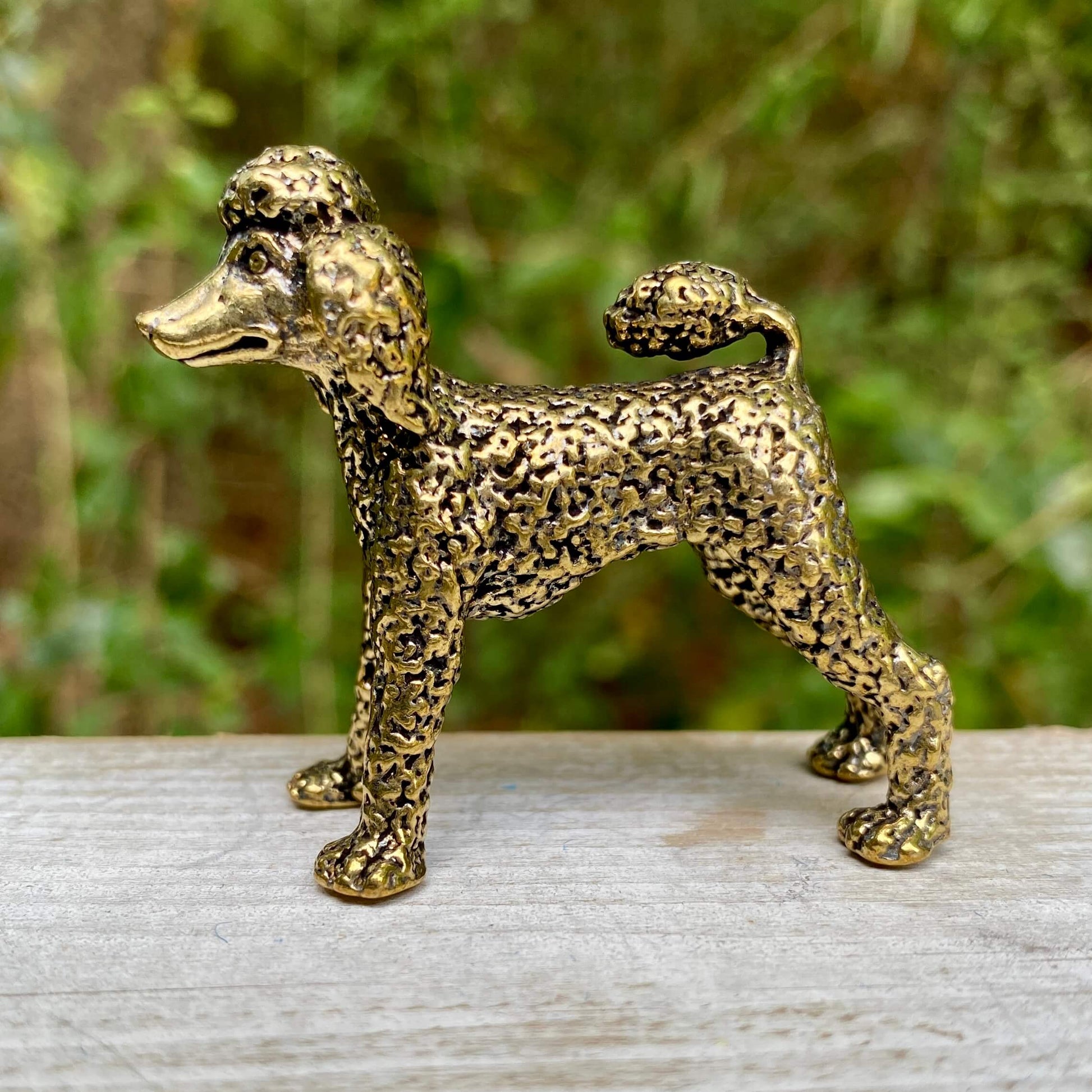 Solid brass poodle sculpture by Wild Brass, showcasing an elegant, detailed poodle figure symbolizing intelligence and loyalty.