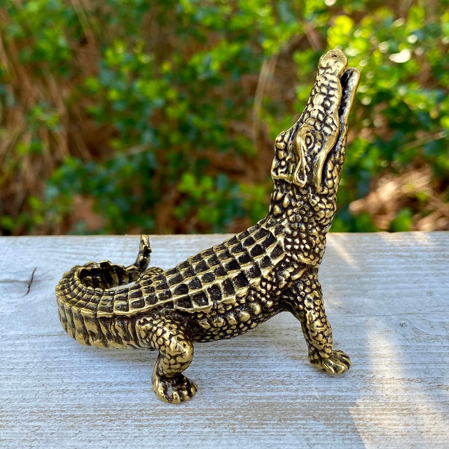 Solid brass alligator sculpture by Wild Brass, symbol of primal power, patience, and instinct, shown in detailed close-up.