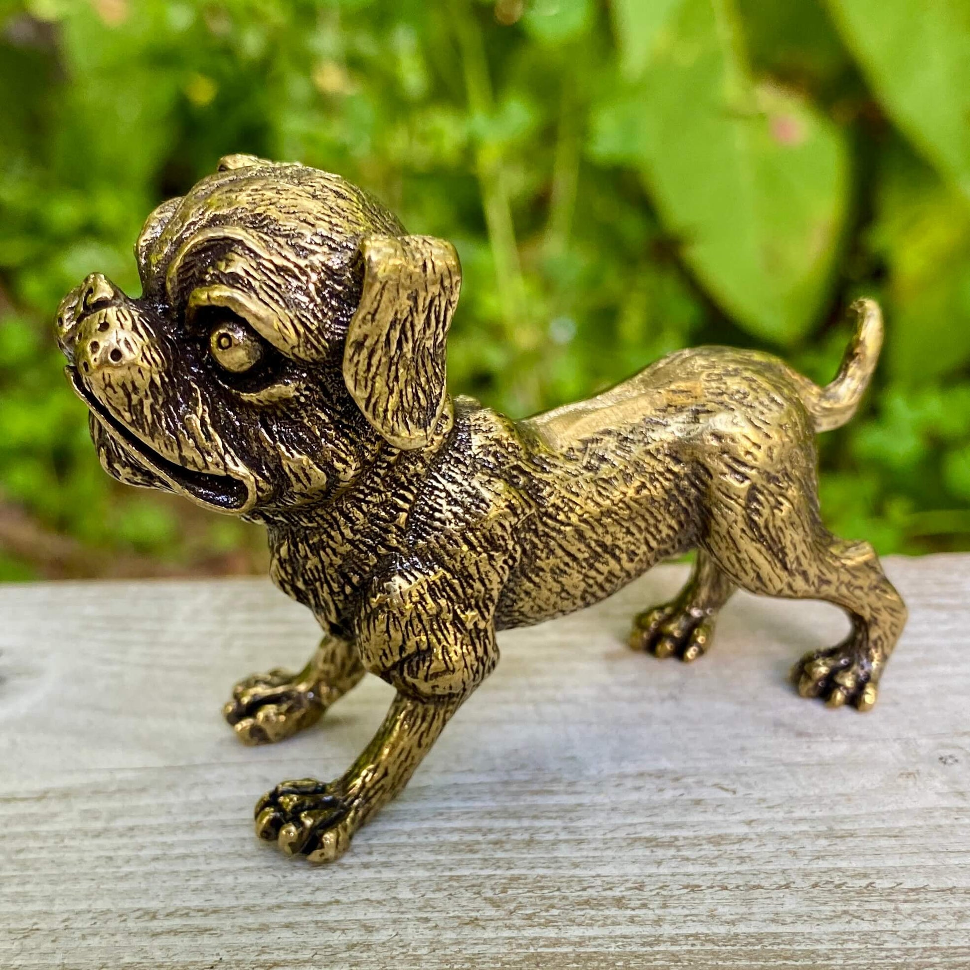 Solid brass Ugly Pug dog figurine by Wild Brass, symbolizing devotion, playfulness, and good fortune.