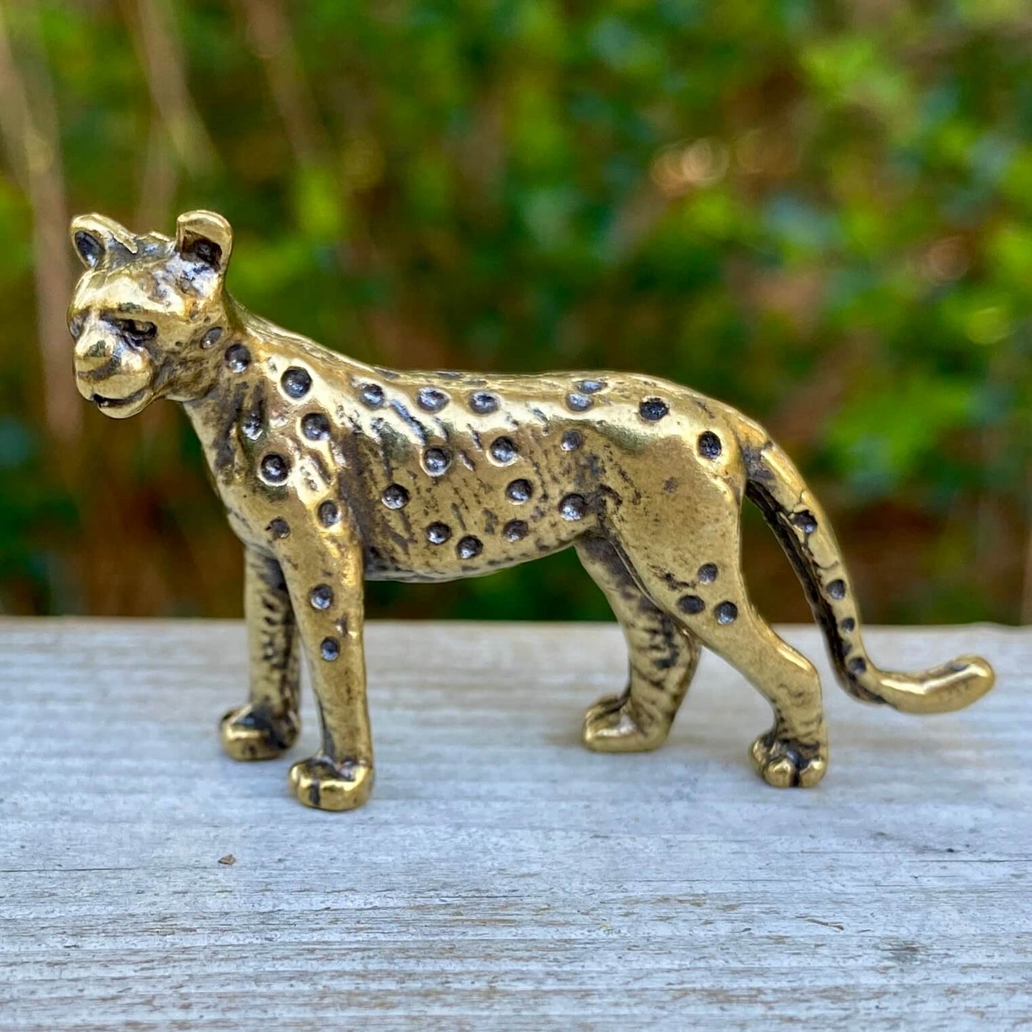 Solid brass leopard sculpture by Wild Brass, symbol of grace, beauty, and power, detailed animal figurine with polished finish.
