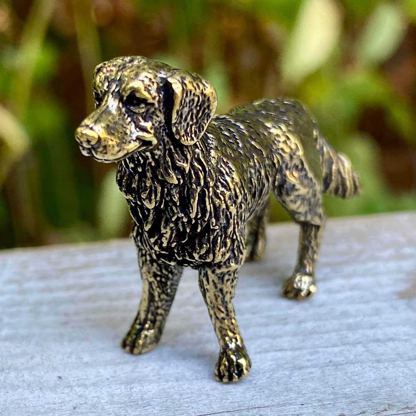 Solid brass Labrador Retriever sculpture by Wild Brass, detailed dog figurine symbolizing loyalty and friendliness.