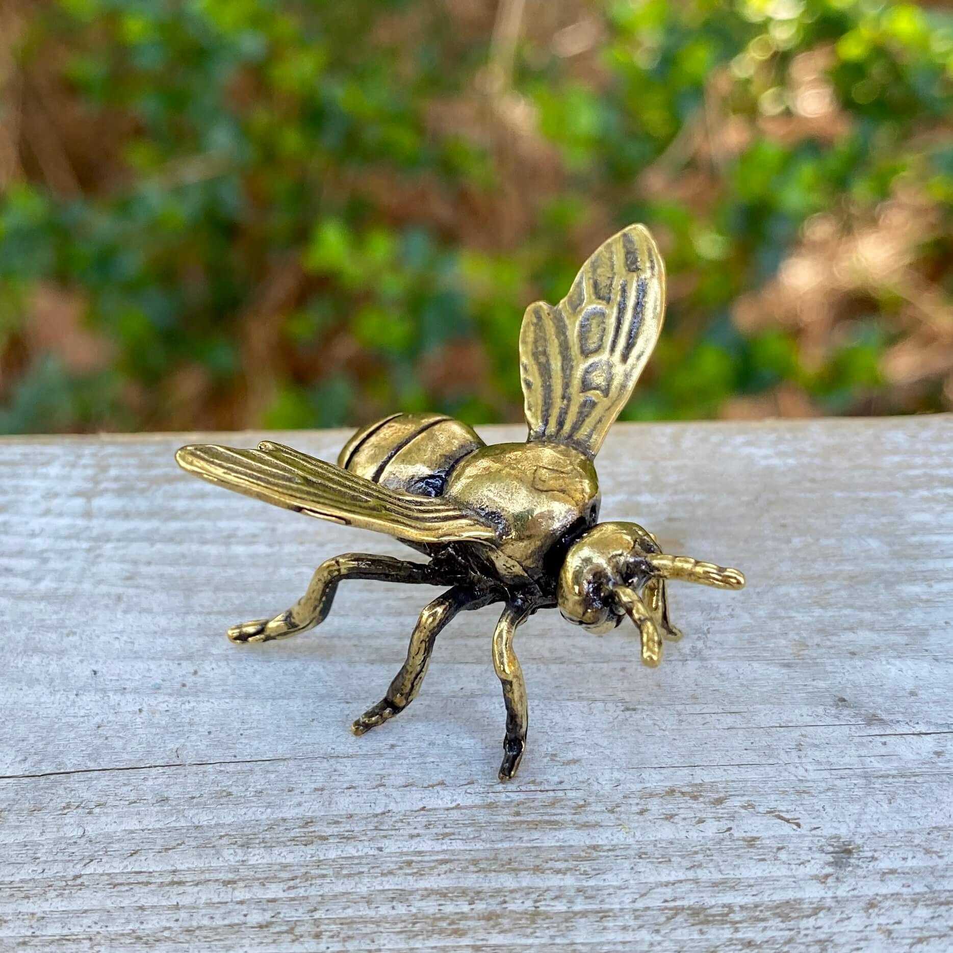 Solid brass bee sculpture from Wild Brass, symbolizing harmony, beauty, and purpose, with intricate details and a polished finish.