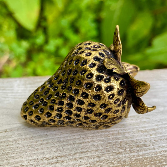 Solid brass strawberry figurine by Wild Brass, symbol of love, passion, and abundance, with detailed craftsmanship.