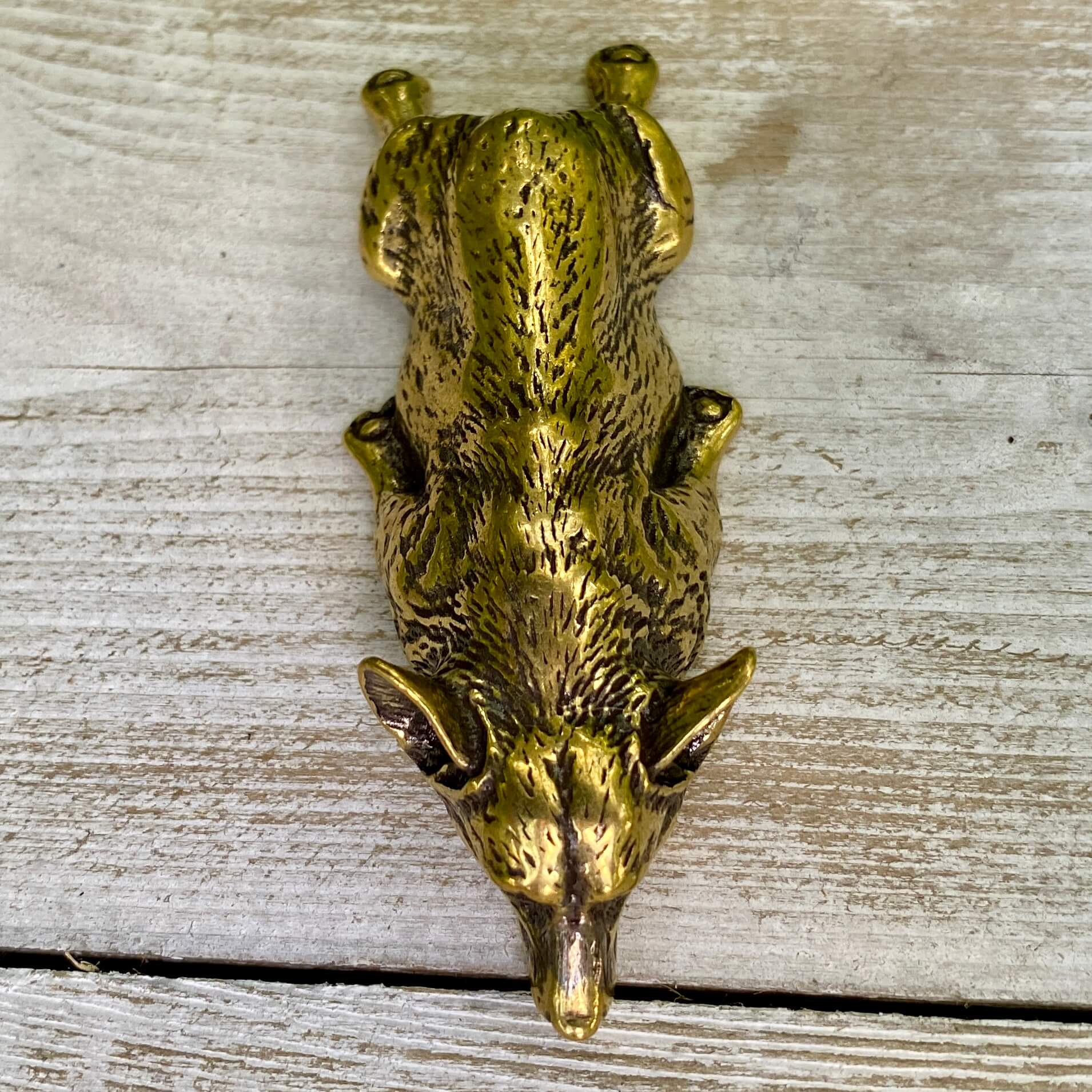 Solid brass Corgi dog figurine by Wild Brass, showcasing a playful Corgi with a joyful and loyal expression, detailed and shiny finish.