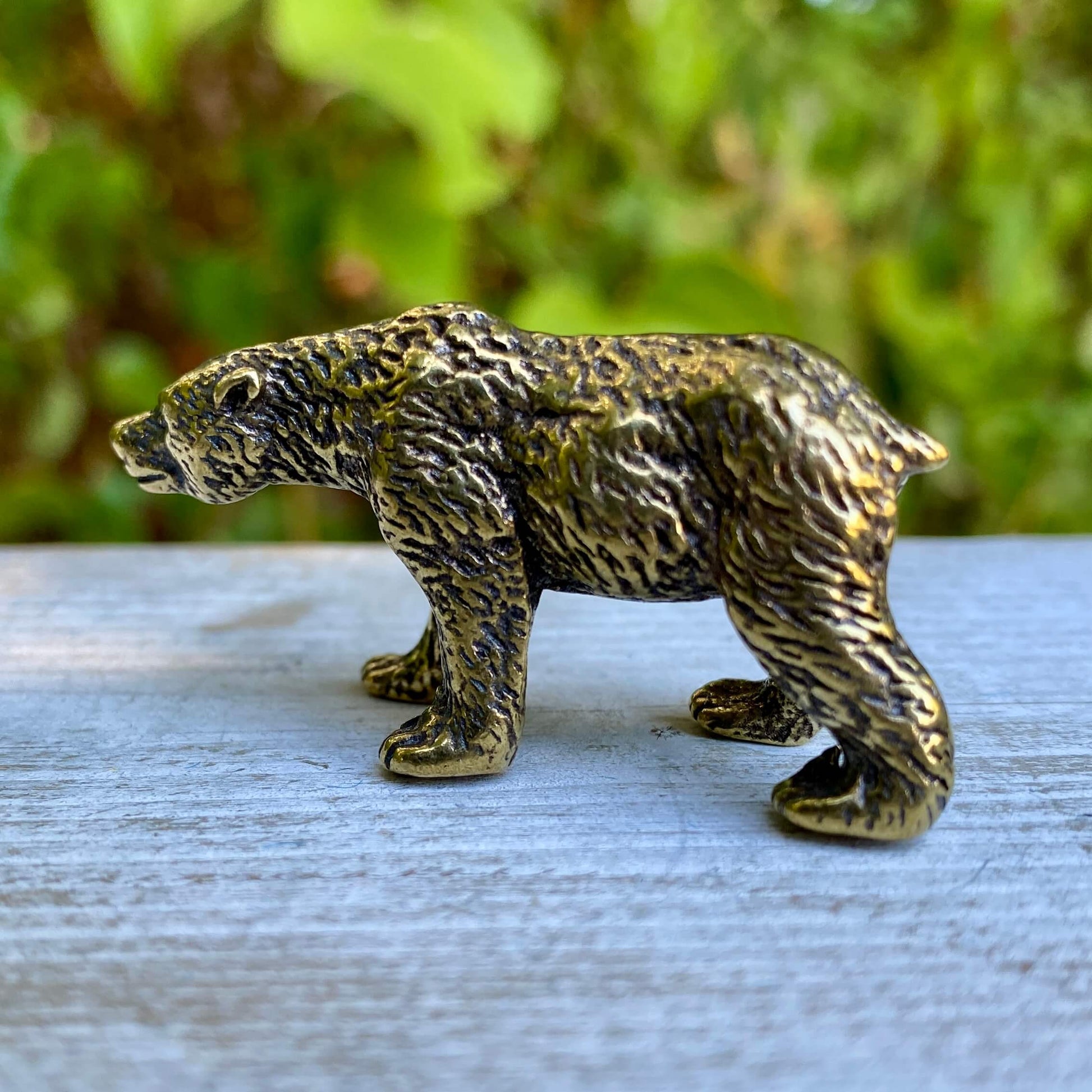 Solid brass bear figurine by Wild Brass, symbol of strength, protection, and inner power, detailed and polished surface.