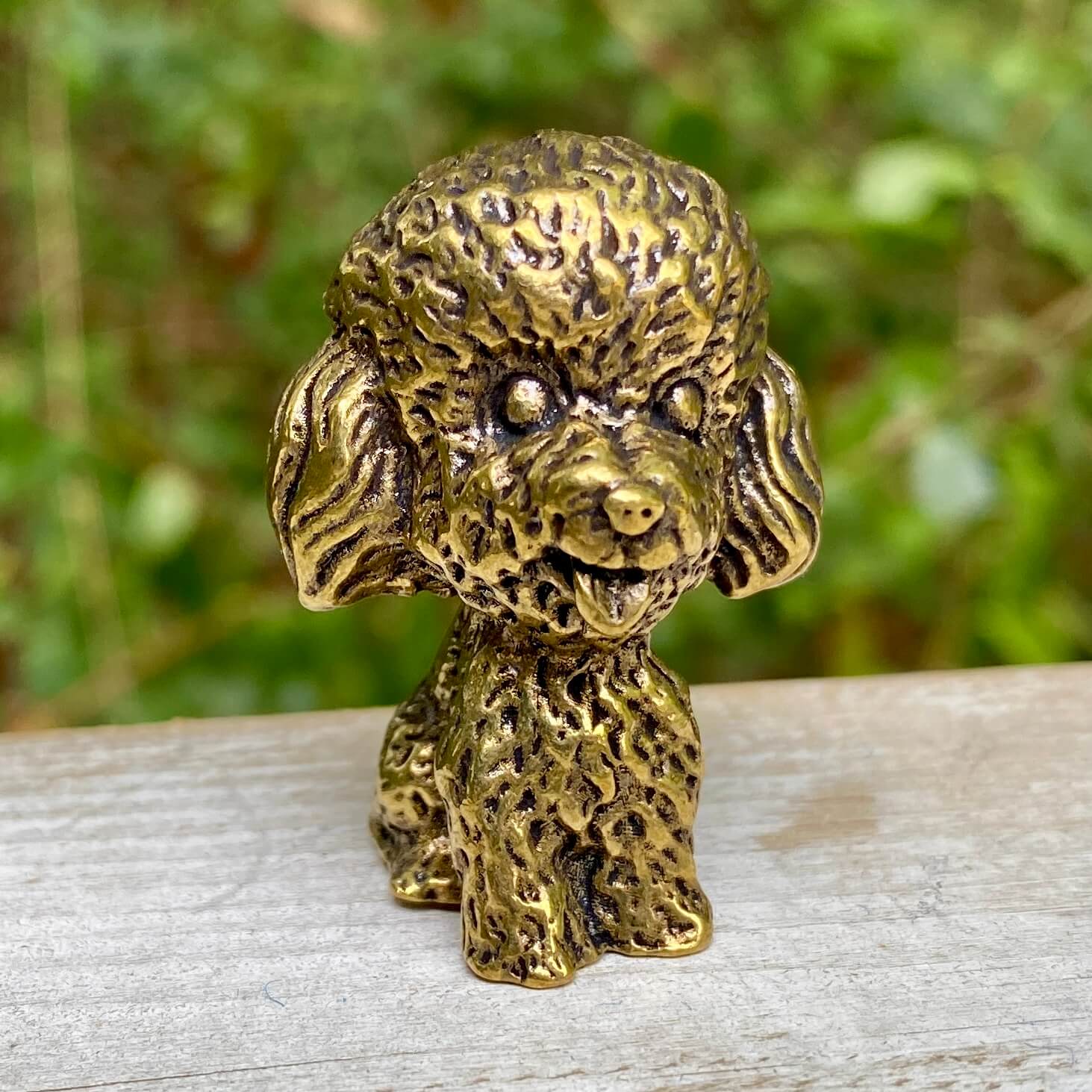 Solid brass poodle figurine by Wild Brass showcasing an elegant, detailed dog sculpture symbolizing intelligence and loyalty.