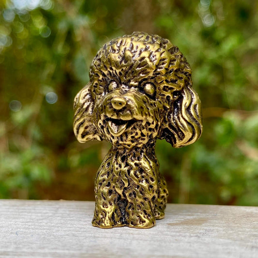 Solid brass poodle figurine by Wild Brass, showcasing detailed craftsmanship, elegance, and a symbol of loyalty and intelligence.