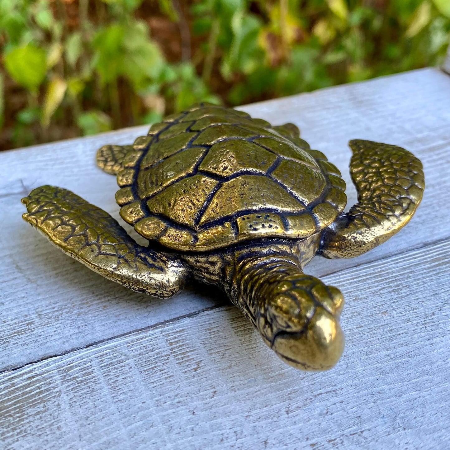 Large solid brass sea turtle sculpture by Wild Brass, symbolizing longevity, wisdom, and endurance, with detailed shell and flippers.