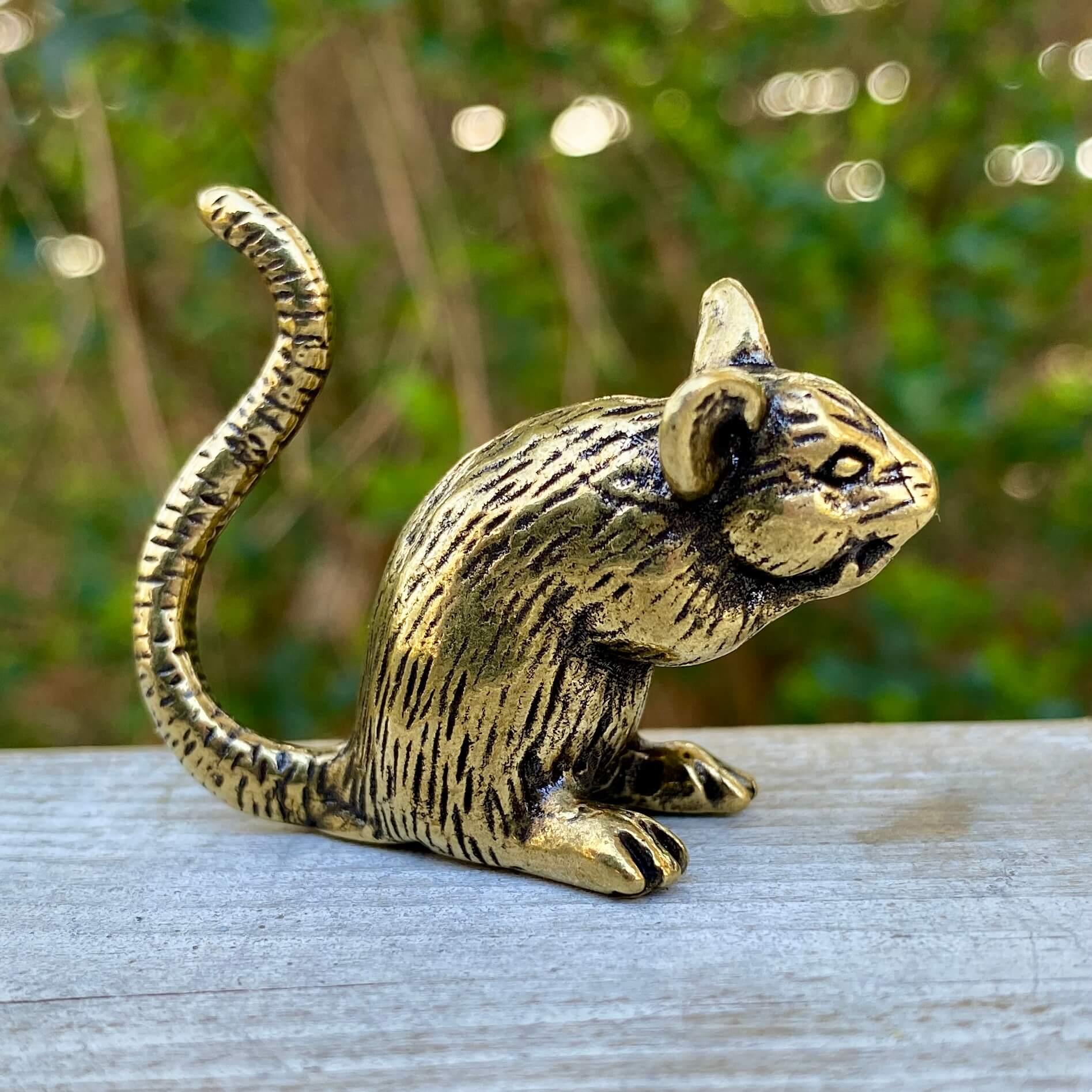 Solid brass rat figurine by Wild Brass, symbol of intelligence, resourcefulness, and survival, detailed and polished finish.