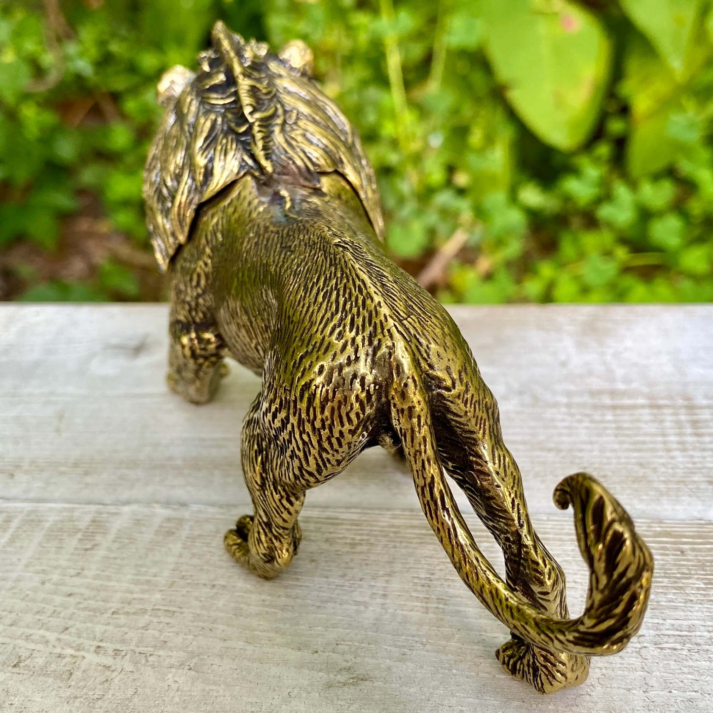 Solid brass lion sculpture by Wild Brass, symbol of courage, leadership, and strength, showcasing detailed craftsmanship.