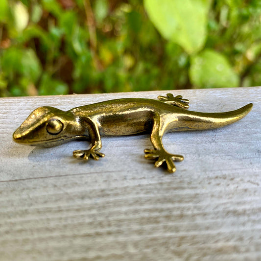 Solid brass gecko sculpture by Wild Brass, symbol of renewal, adaptability, and resilience, featuring detailed craftsmanship.