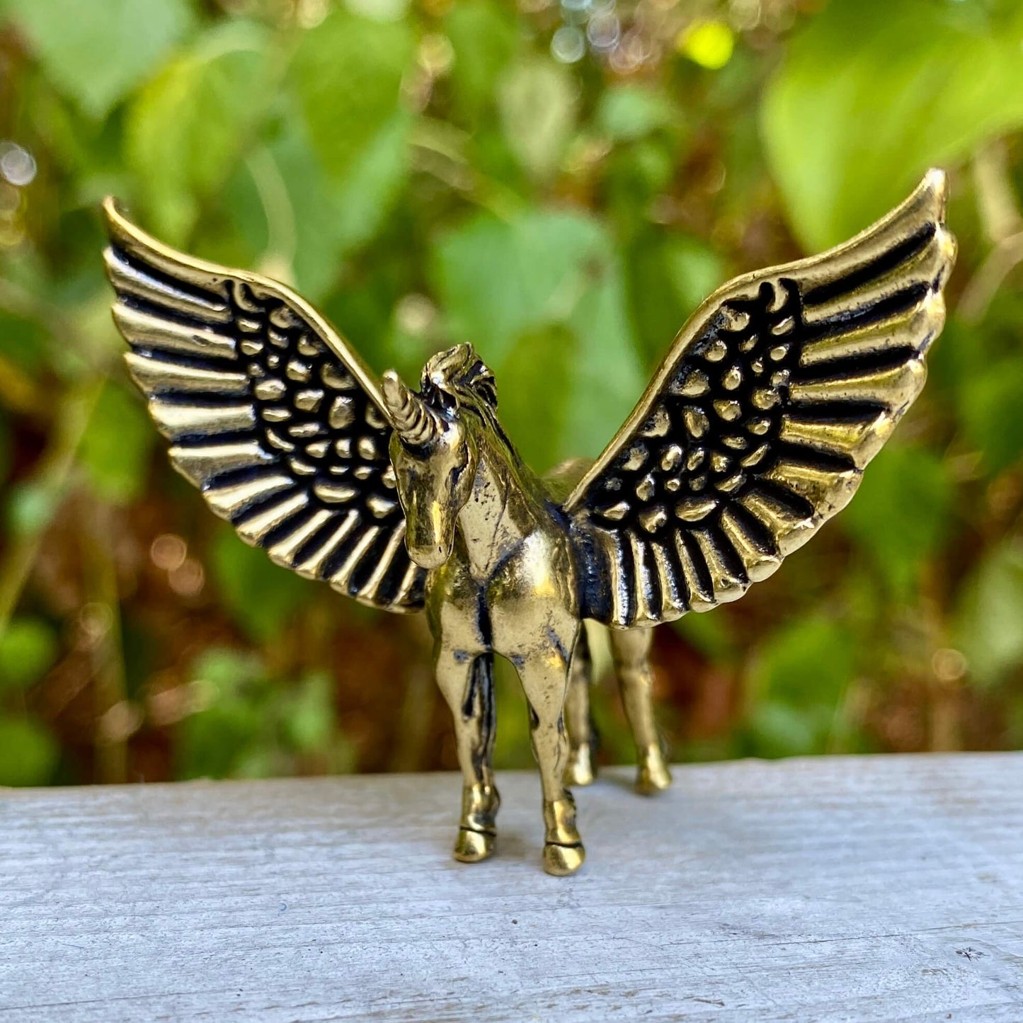 Solid brass Pegasus figurine by Wild Brass, symbol of freedom, inspiration, and divine power, shown on a neutral background.