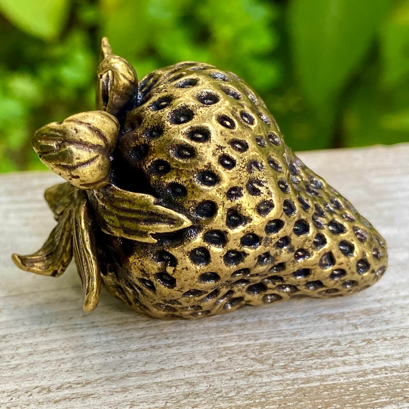Solid brass strawberry sculpture by Wild Brass, symbol of love, passion, and abundance, detailed and polished finish.
