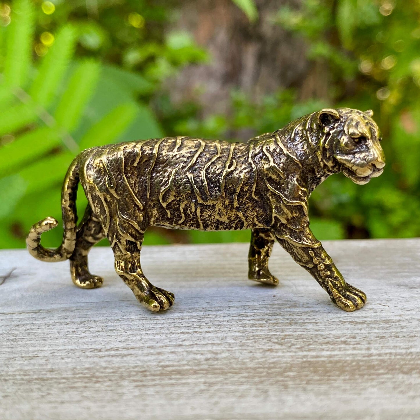 Solid brass tiger sculpture by Wild Brass, symbol of power, passion, and independence, detailed and polished finish.