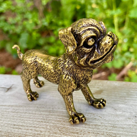 Solid brass Ugly Pug dog figurine by Wild Brass, showcasing playful expression and detailed craftsmanship, symbol of devotion and good fortune.