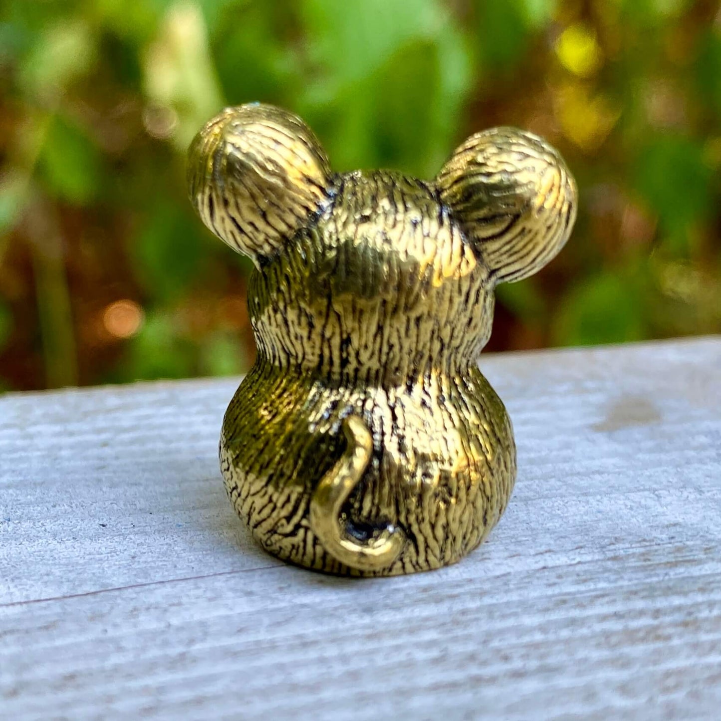 Solid brass mouse sculpture by Wild Brass, symbolizing curiosity, adaptability, and awareness, with detailed craftsmanship.