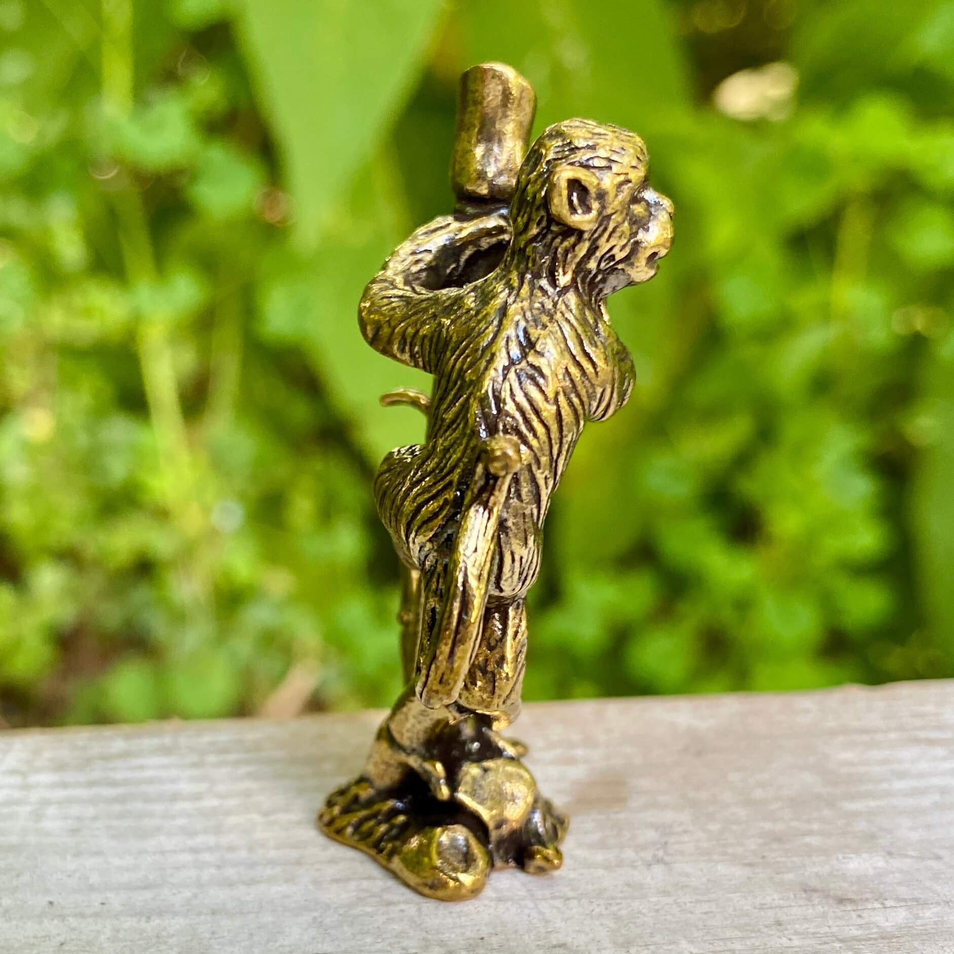 Solid brass monkey sculpture on bamboo base by Wild Brass, symbolizing balance, joy, and harmony in natural decor.
