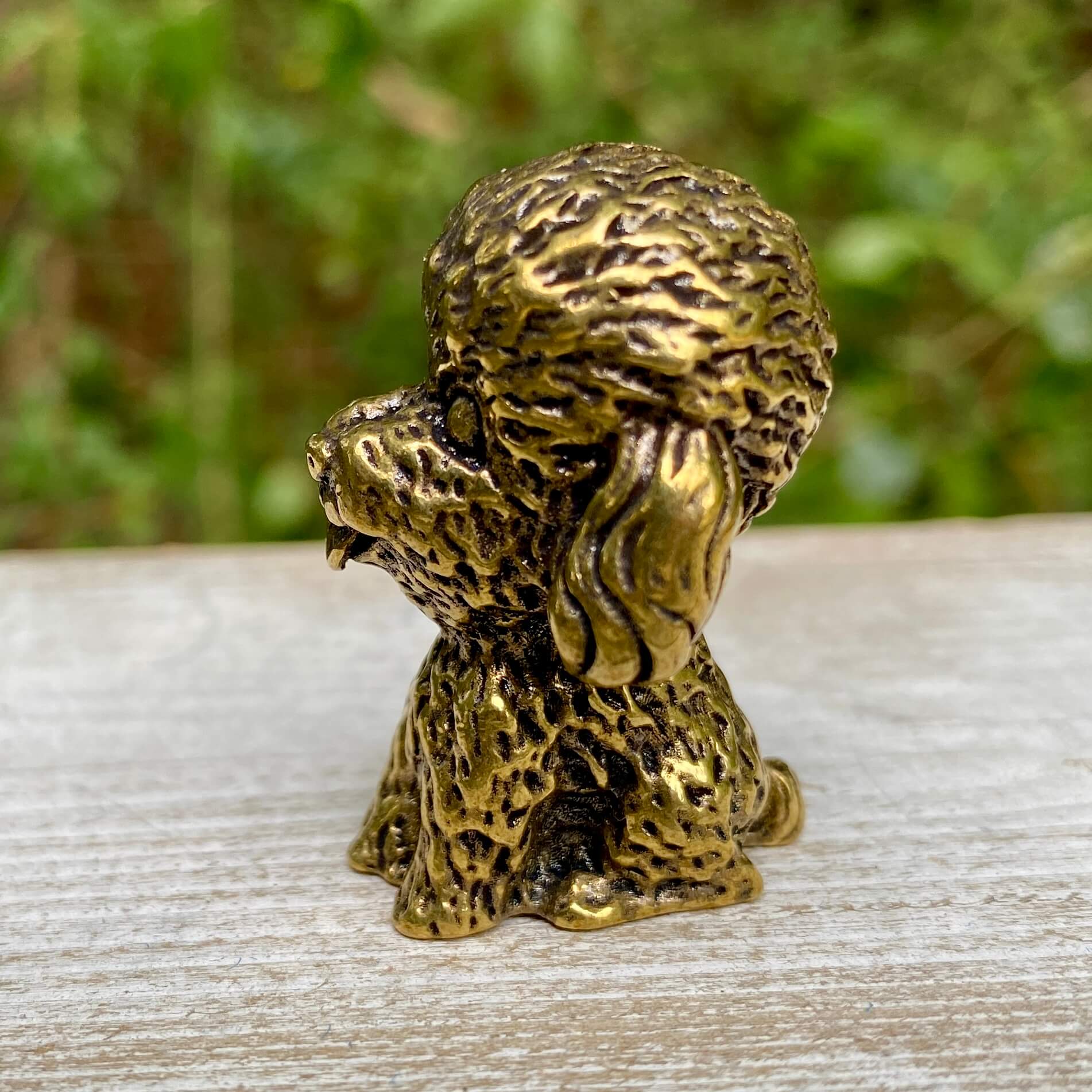 Solid brass poodle figurine by Wild Brass, showcasing a detailed, elegant dog sculpture symbolizing intelligence and loyalty.