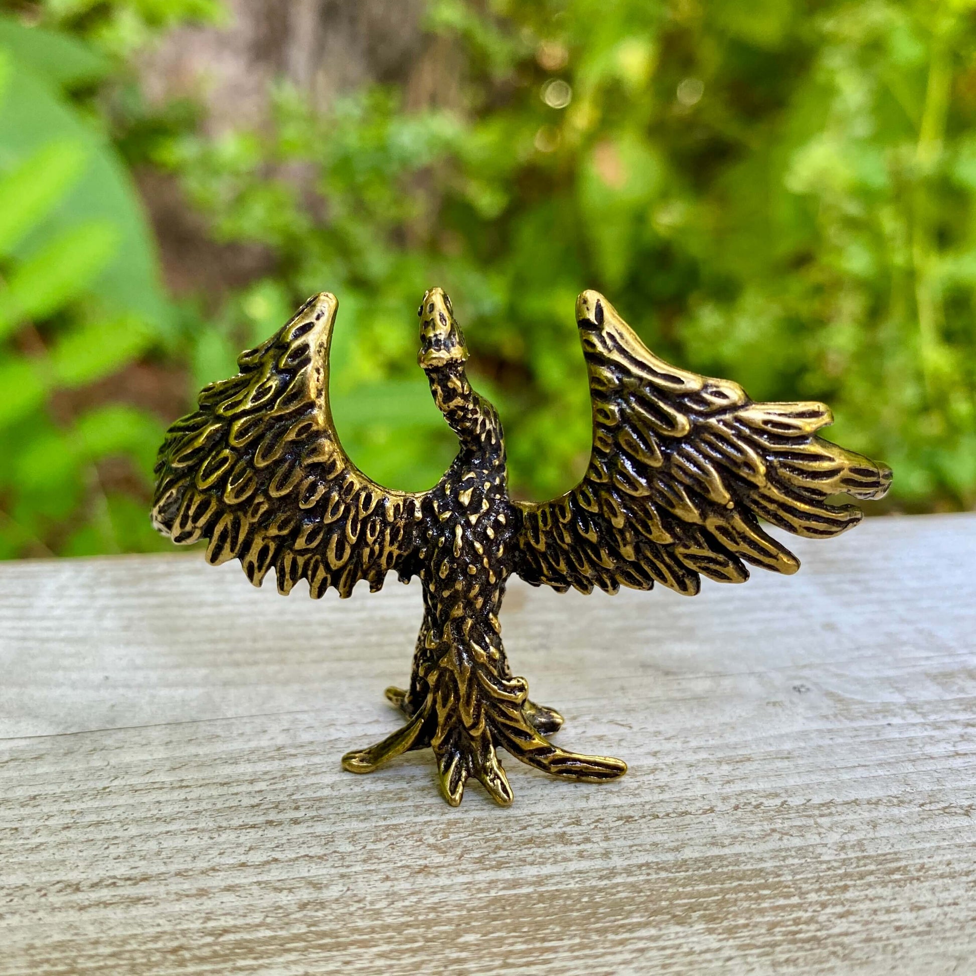 Solid brass phoenix sculpture by Wild Brass, symbol of rebirth and strength with detailed feather design and a sturdy base.