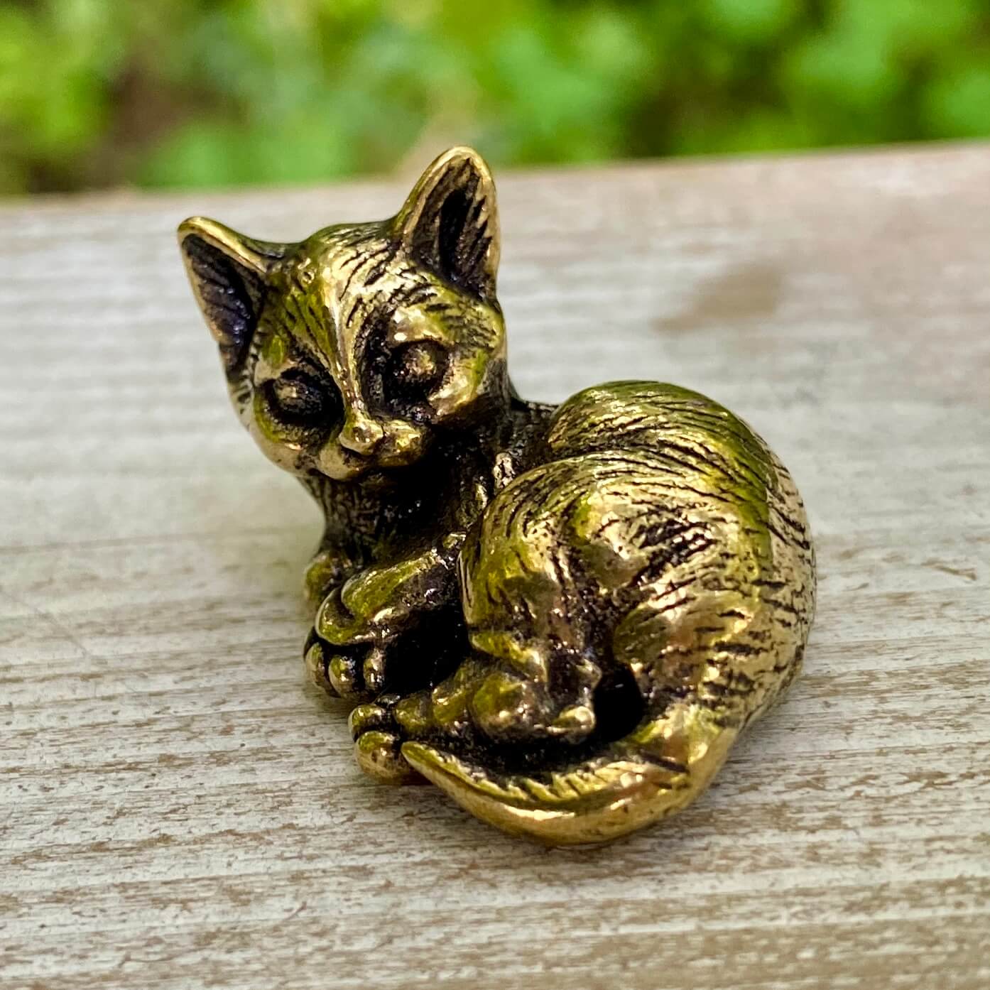 Solid brass cat sculpture from Wild Brass, symbolizing independence, grace, and mystery, featuring a sleek feline design.