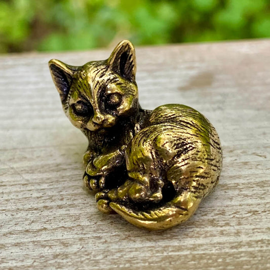 Solid brass cat sculpture from Wild Brass, symbolizing independence, grace, and mystery, featuring a sleek feline design.