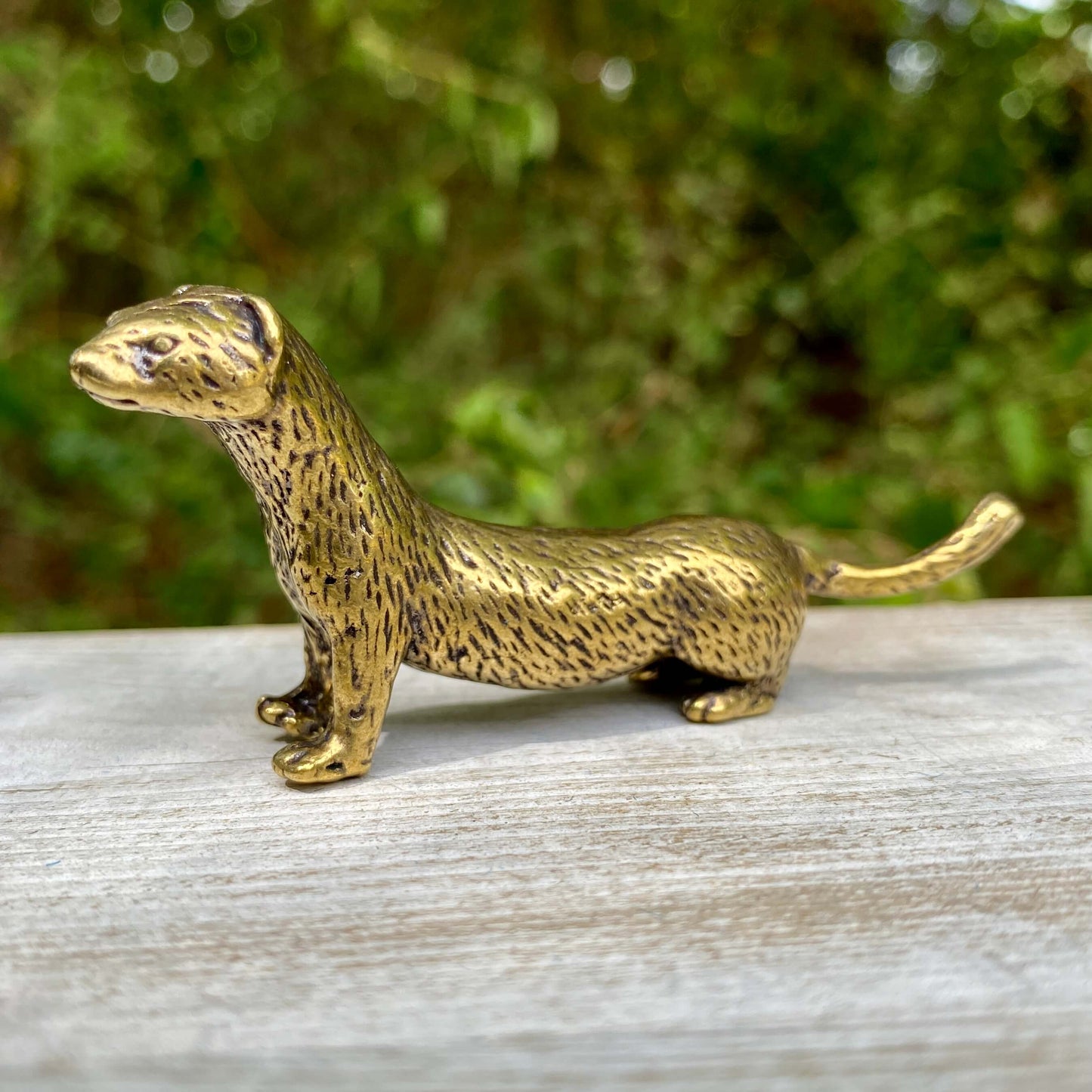 Solid brass weasel figurine by Wild Brass, symbol of cunning, agility, and resourcefulness, with detailed craftsmanship and shiny finish.