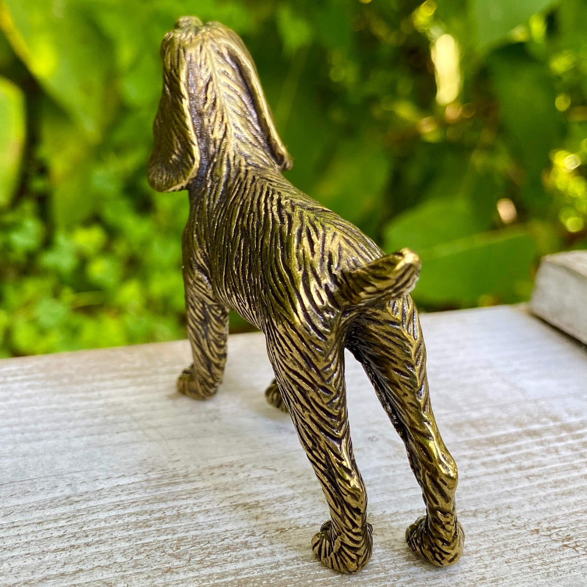 Solid brass cocker spaniel figurine by Wild Brass, showcasing a detailed, gentle-looking dog symbolizing devotion and affection.