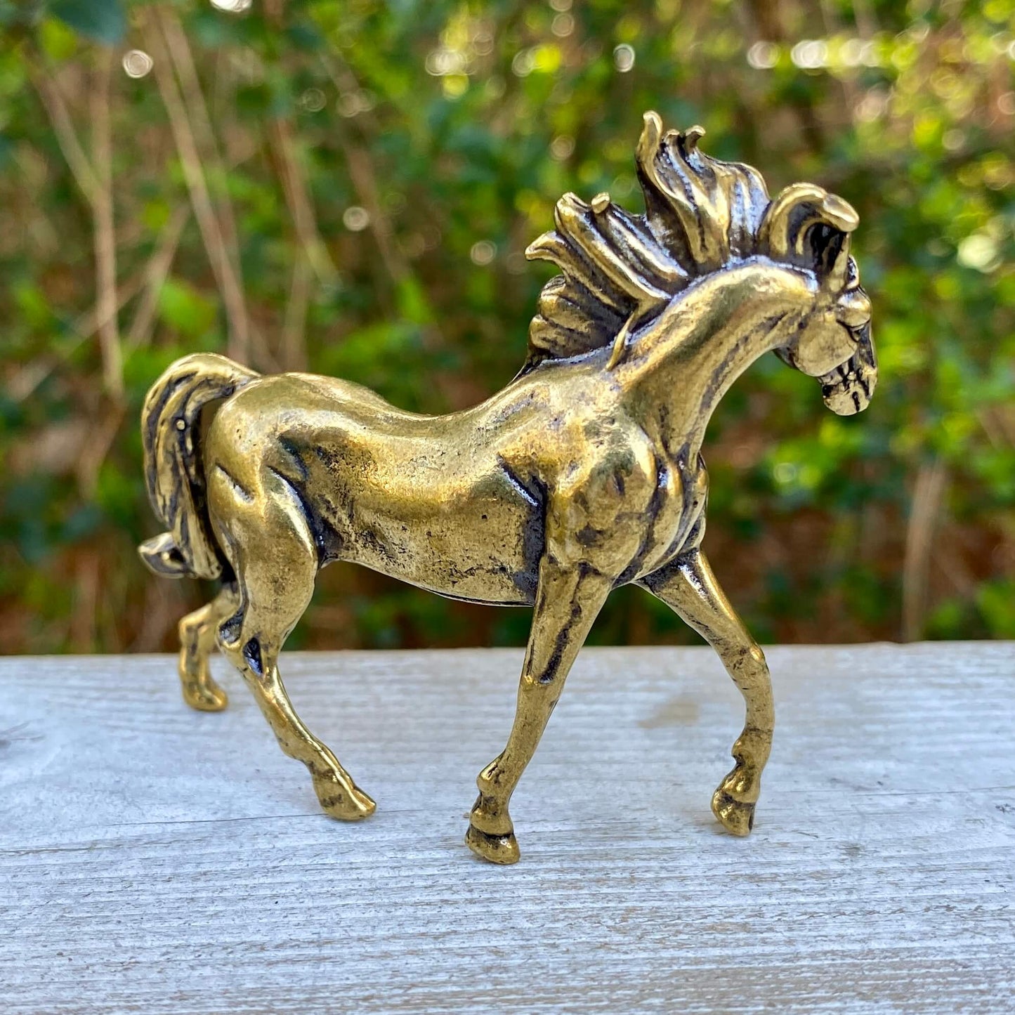 Solid brass horse stallion sculpture by Wild Brass, showcasing a detailed, graceful horse symbolizing freedom and power.