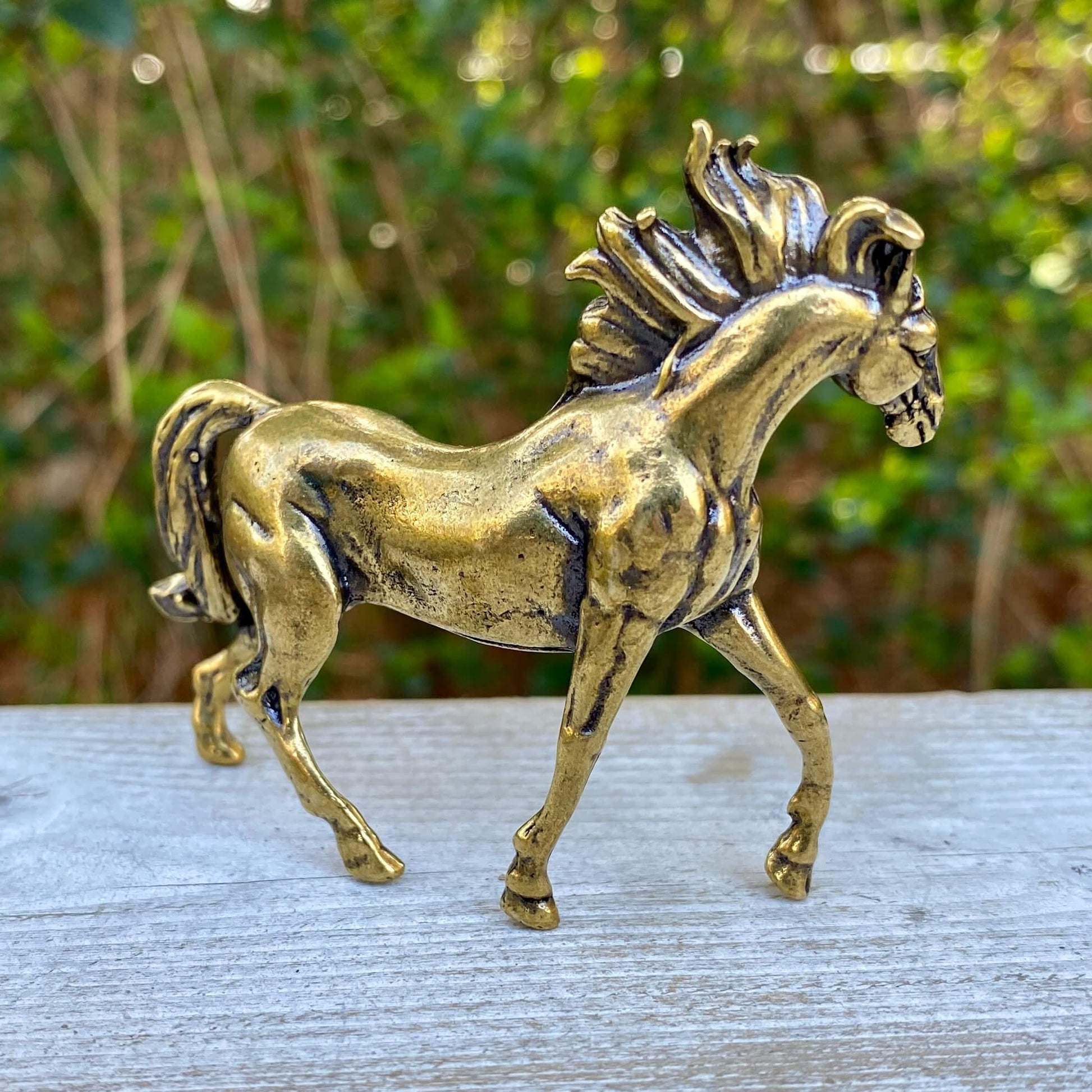 Solid brass horse stallion sculpture by Wild Brass, showcasing a detailed, graceful horse symbolizing freedom and power.