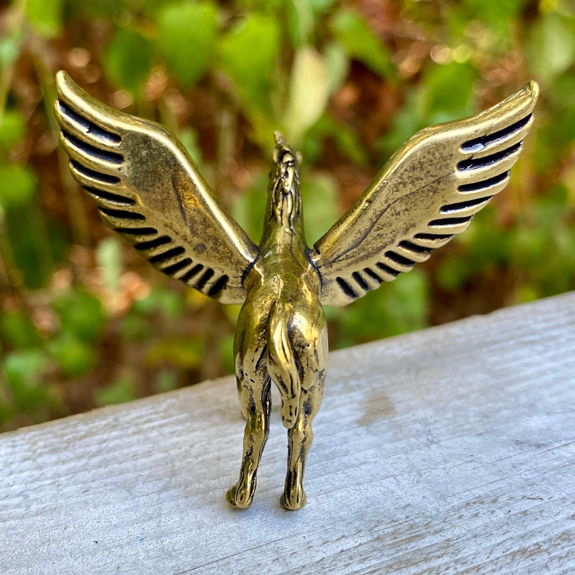 Solid brass Pegasus sculpture by Wild Brass, symbol of freedom, inspiration, and divine power, with detailed wings and dynamic pose.