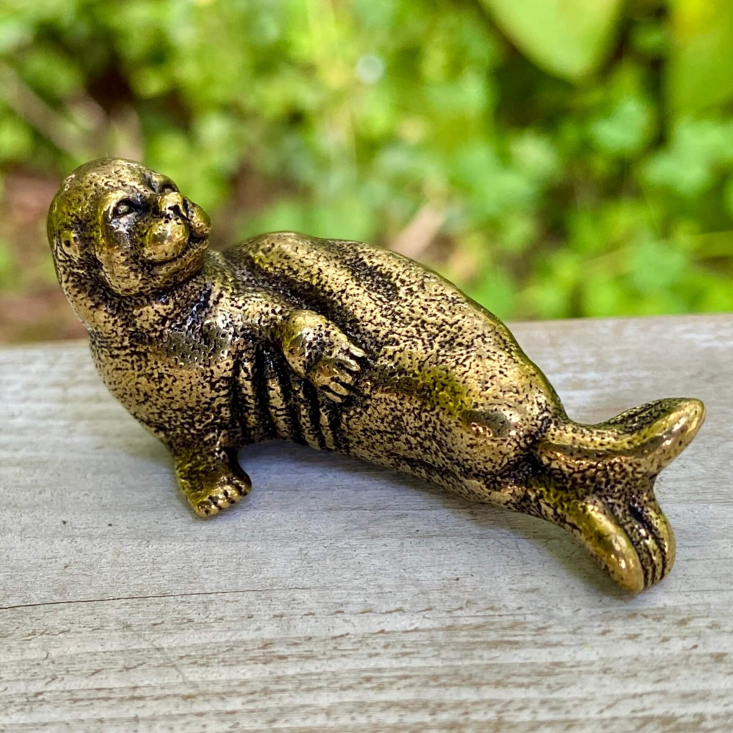 Solid brass walrus figurine by Wild Brass, symbol of wisdom, strength, and community, with detailed craftsmanship and a polished finish.