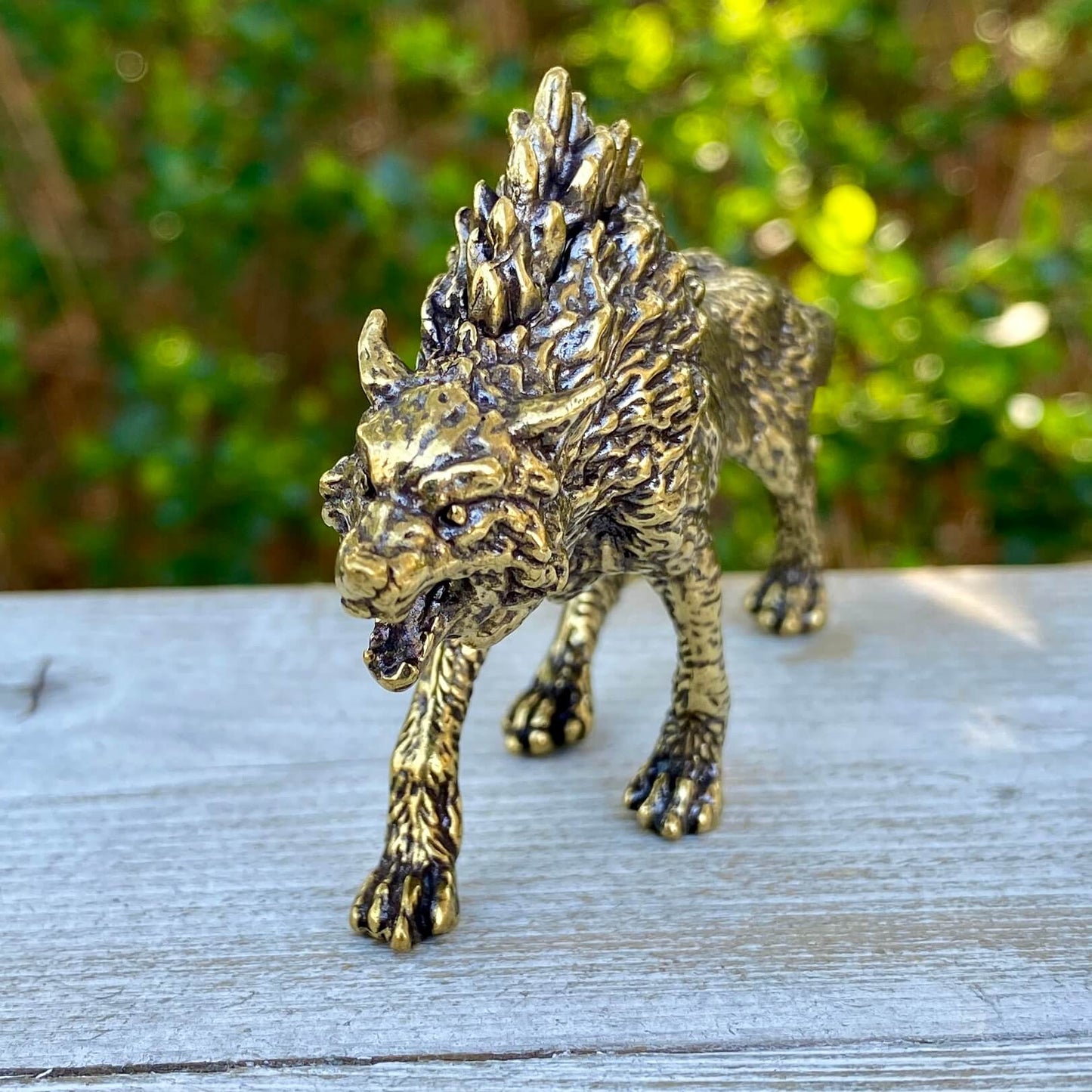 Solid brass Wolverine symbol from Wild Brass, representing independence, survival, and untamed spirit, with detailed craftsmanship.