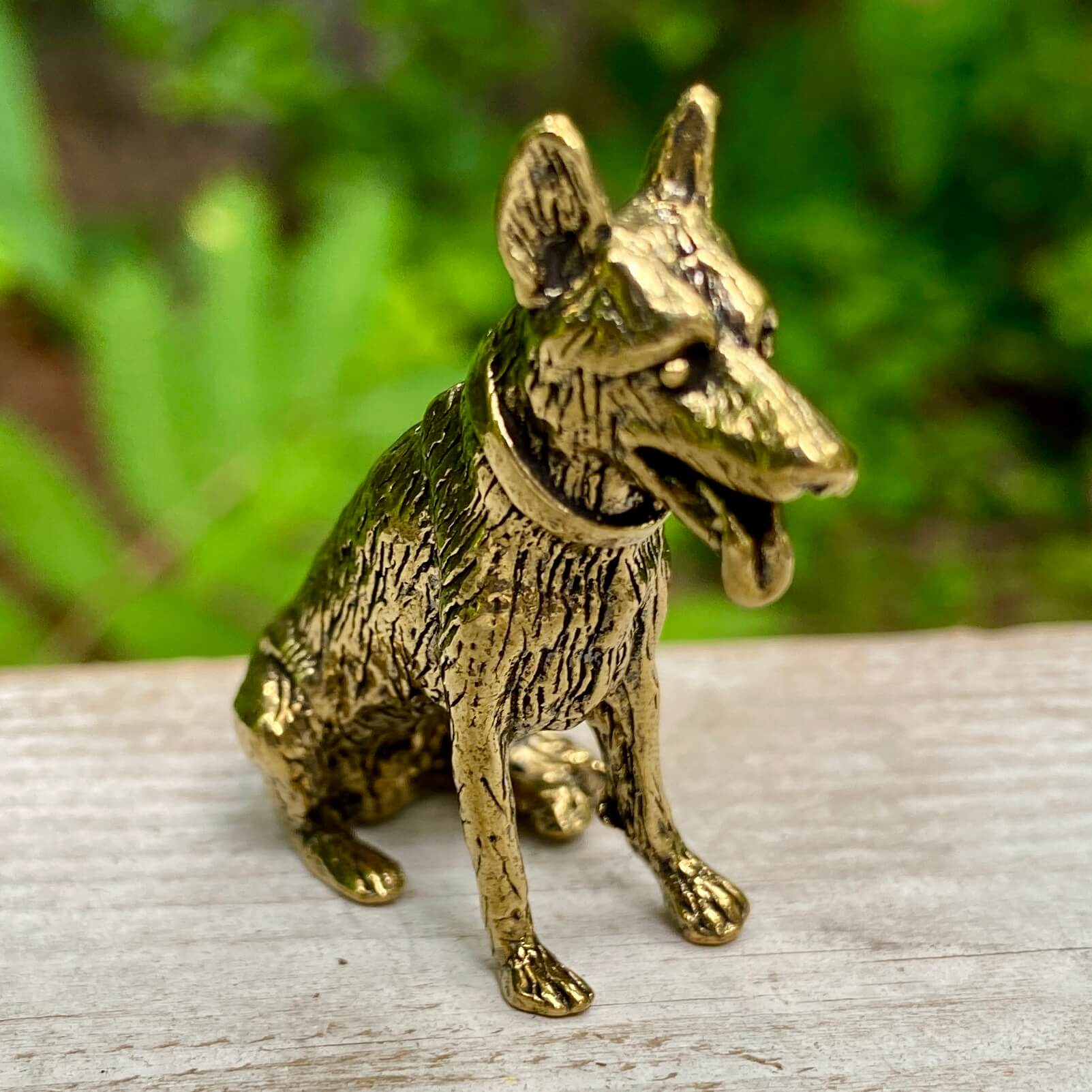 Solid brass German Shepherd sculpture by Wild Brass, symbolizing loyalty, courage, and protection, displayed in detailed craftsmanship.