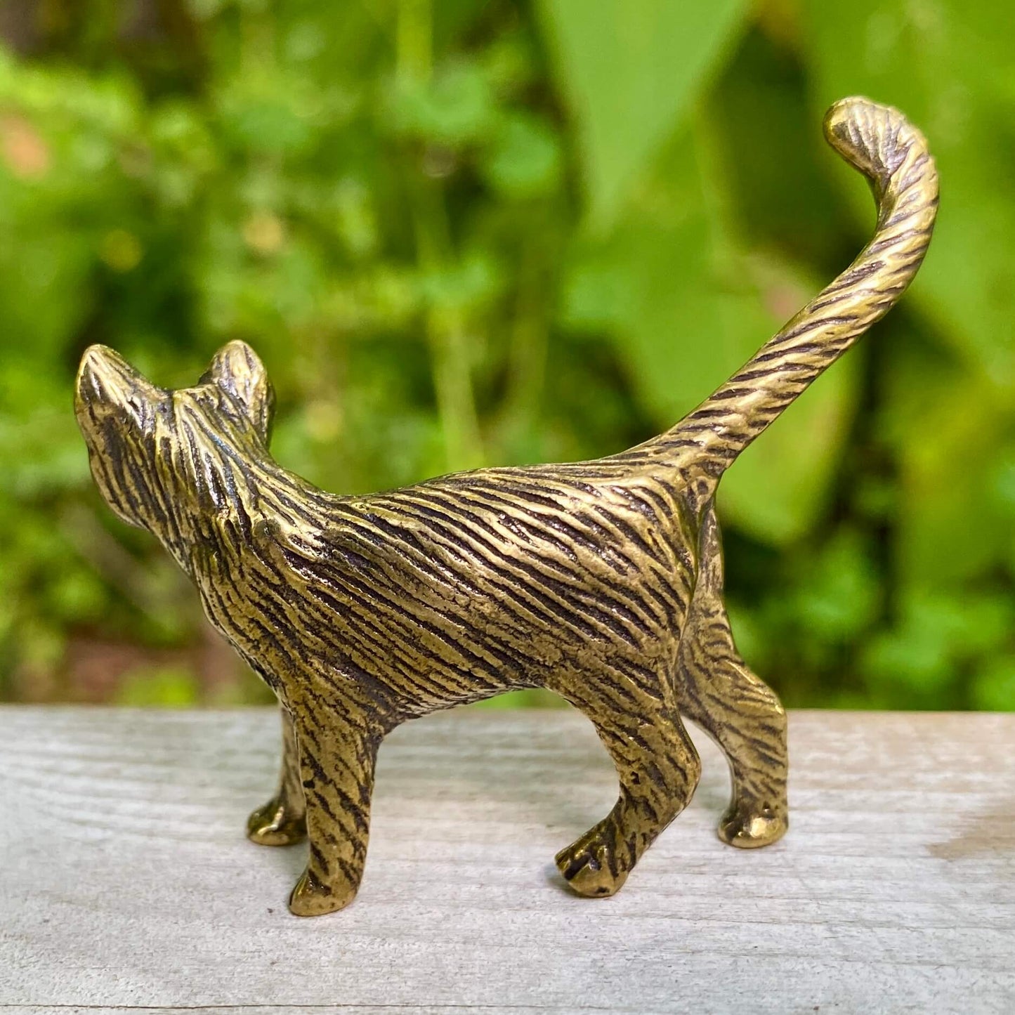 Solid brass cat sculpture by Wild Brass, symbolizing independence, mystery, and intuition, with intricate feline details.
