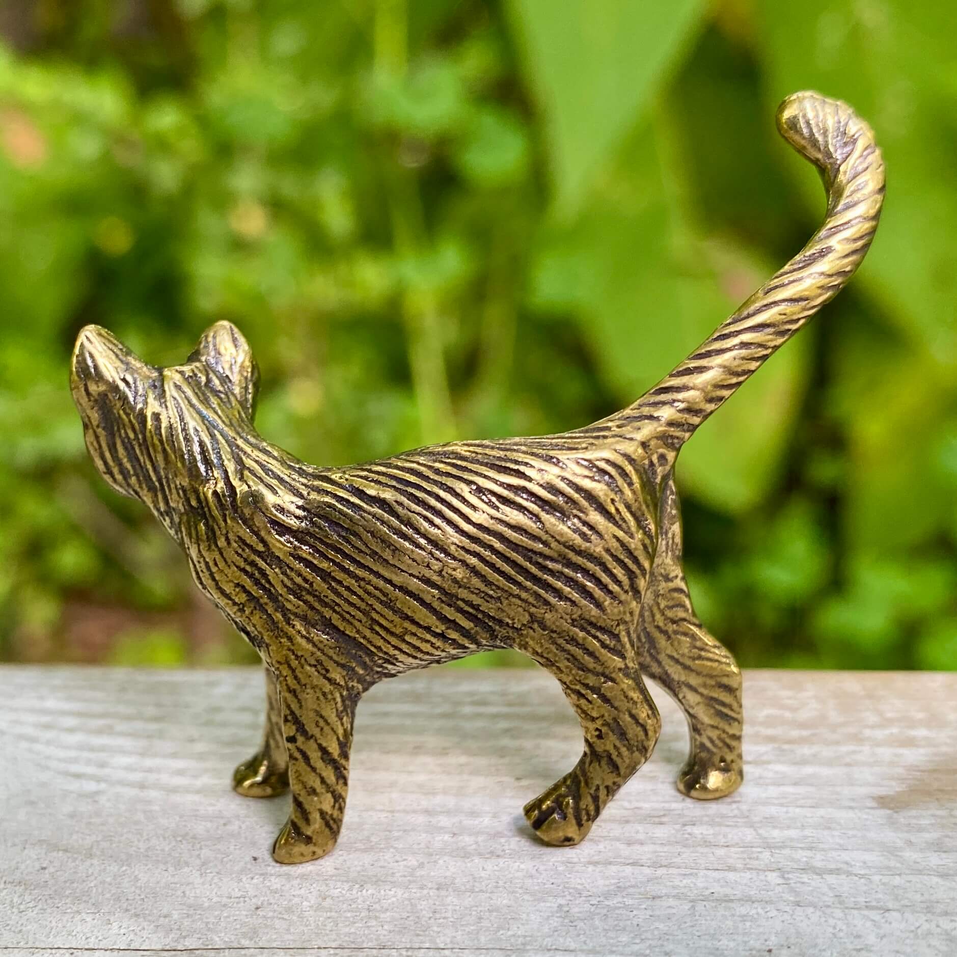 Solid brass cat sculpture by Wild Brass, symbolizing independence, mystery, and intuition, with intricate feline details.