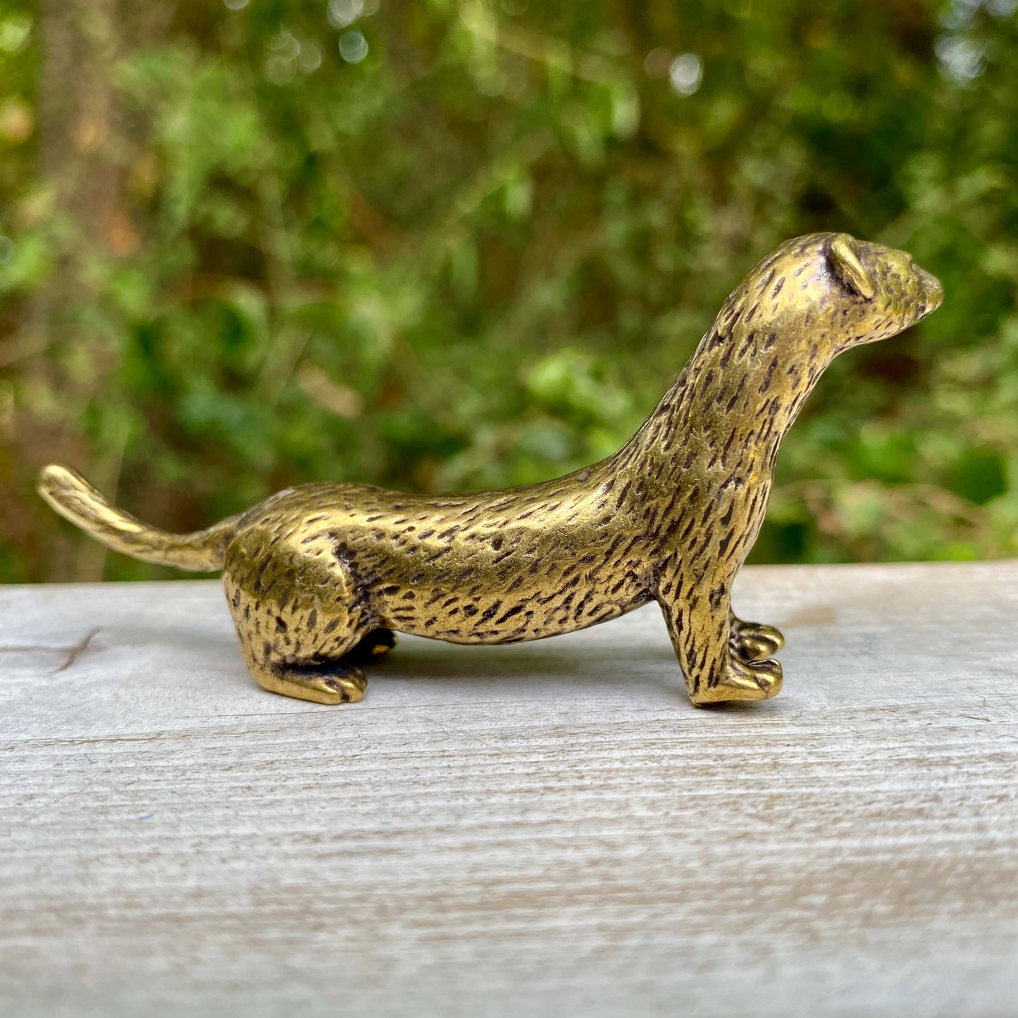 Solid brass weasel figurine by Wild Brass, symbolizing cunning, agility, and resourcefulness, detailed and polished finish.