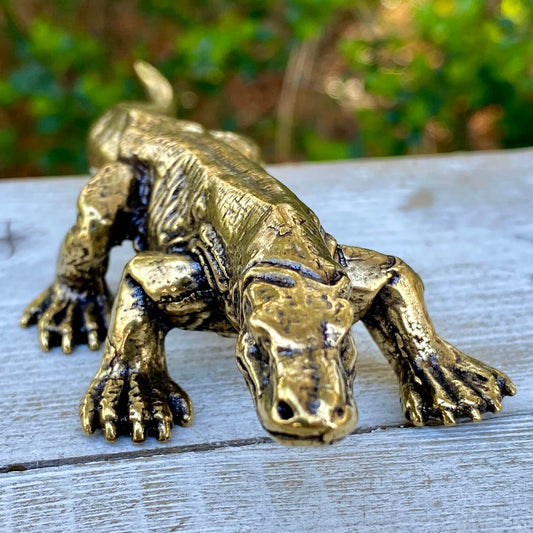 Solid brass Komodo dragon sculpture by Wild Brass, symbol of strength, wisdom, and instinct, detailed and handcrafted.