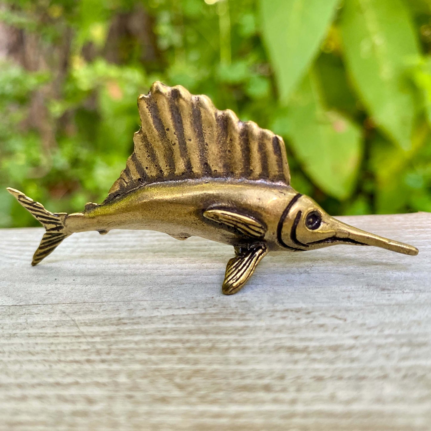Solid brass marlin fish sculpture by Wild Brass, showcasing a sleek marlin design symbolizing speed and nobility.
