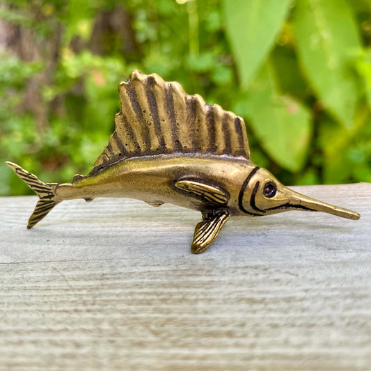 Solid brass marlin fish sculpture by Wild Brass, showcasing a sleek marlin design symbolizing speed and nobility.