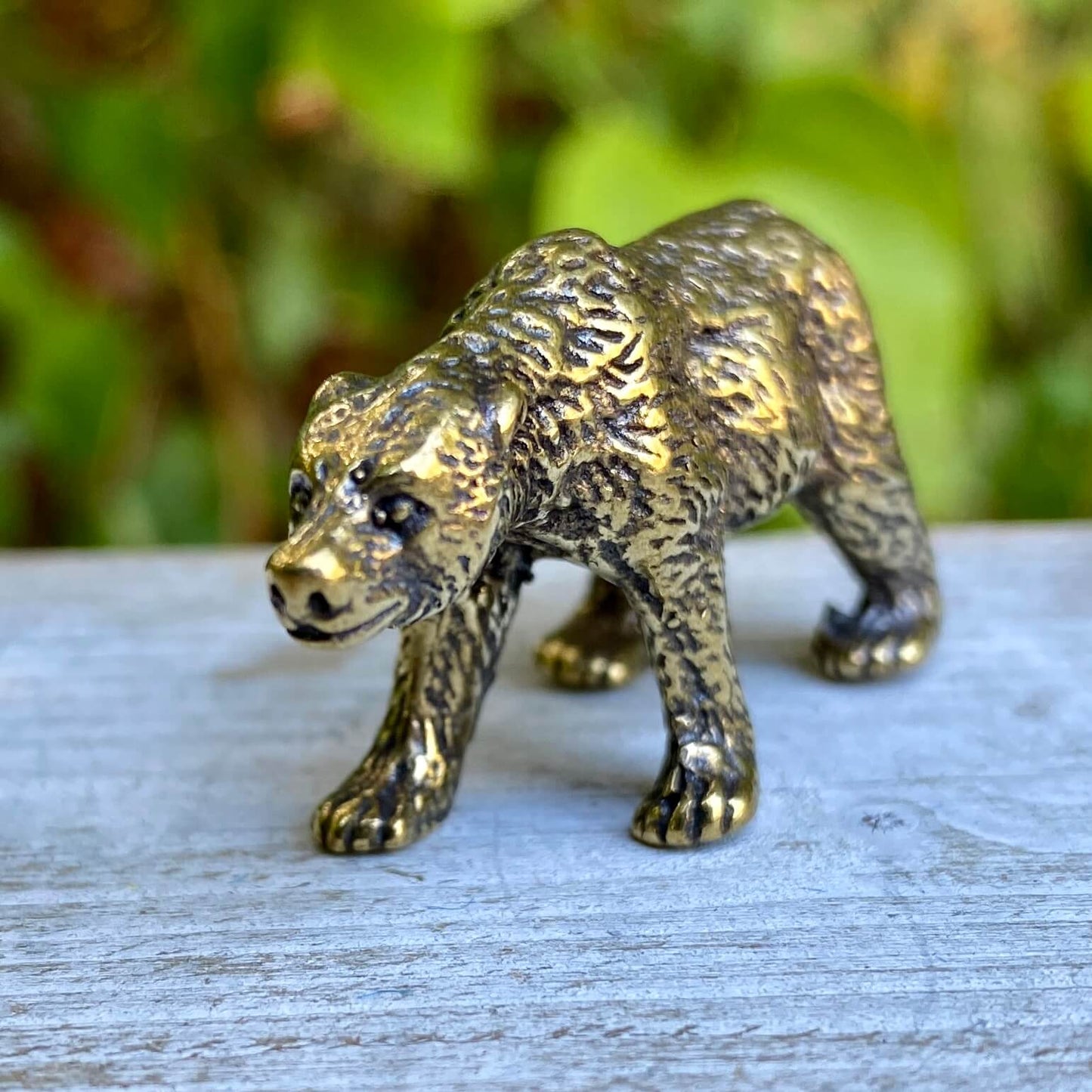 Solid brass bear sculpture by Wild Brass, symbol of strength, protection, and inner power, shown in detailed close-up.