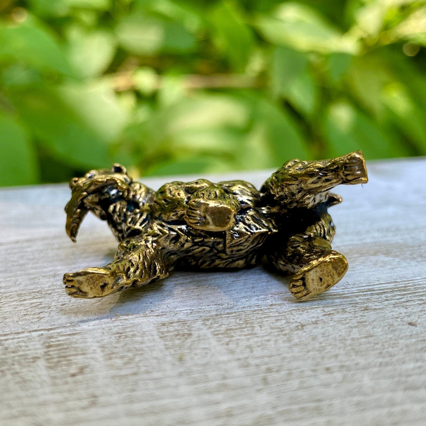 Solid brass grizzly bear sculpture by Wild Brass, symbol of strength, courage, and leadership, detailed and polished finish.