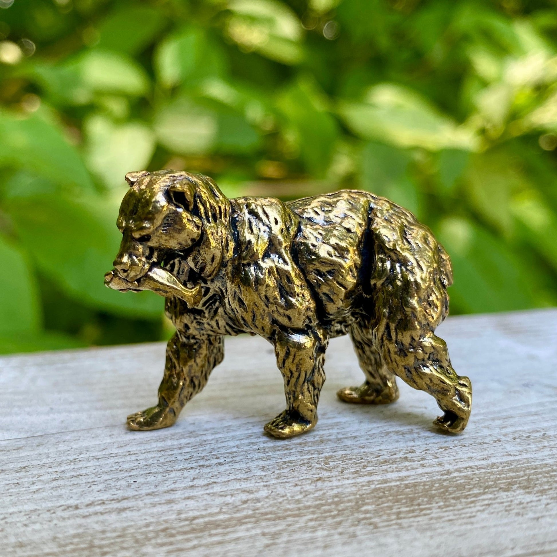 Solid brass grizzly bear sculpture by Wild Brass, symbol of strength, courage, and leadership, detailed and polished finish.