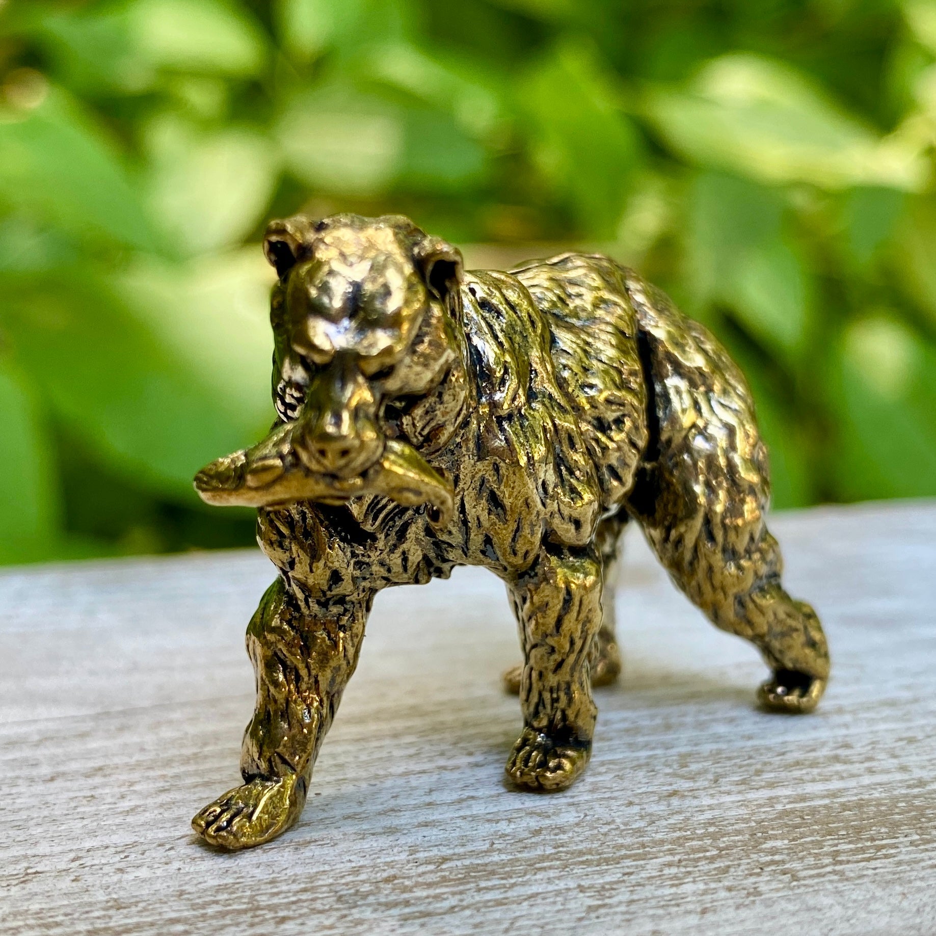 Solid brass grizzly bear sculpture by Wild Brass, symbol of strength, courage, and leadership, featuring detailed craftsmanship.