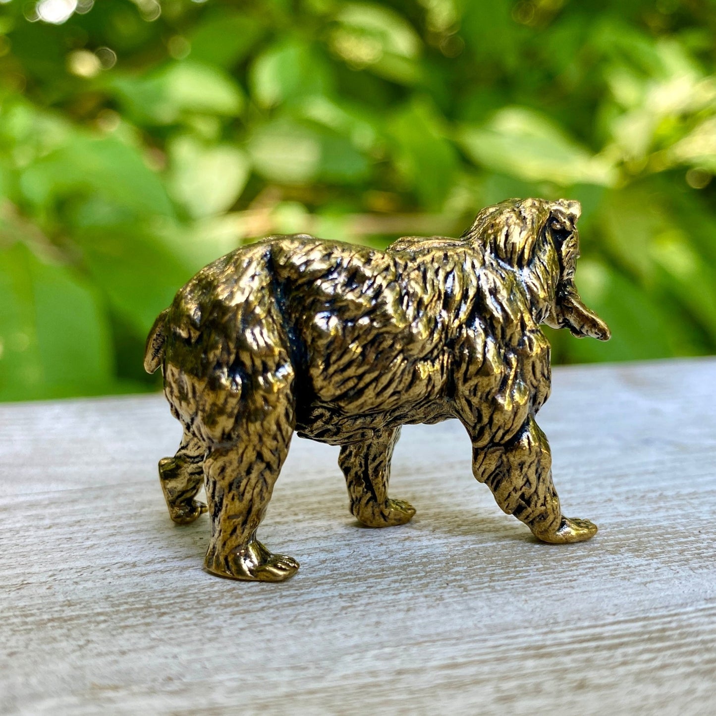 Solid brass grizzly bear sculpture by Wild Brass, symbol of strength, courage, and leadership, detailed and polished finish.